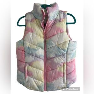 So girls size 14/16 puffer vest.  Pretty pastel colors.  Front pockets.
